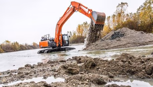 Крупнейший в мире японский конгломерат Hitachi запускает в 2024 году выпуск пары супер длинноруких экскаваторов